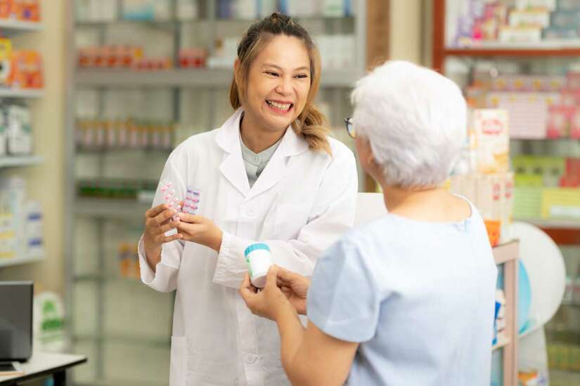 Pharmacist consulting patient